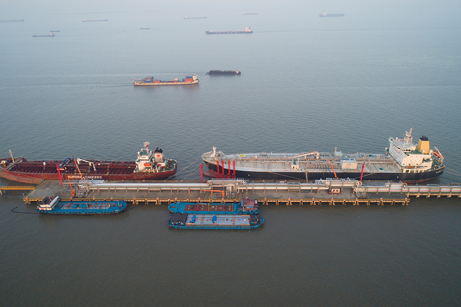 Oil tankers are moored at an oil storage terminal in Taicang Port, China